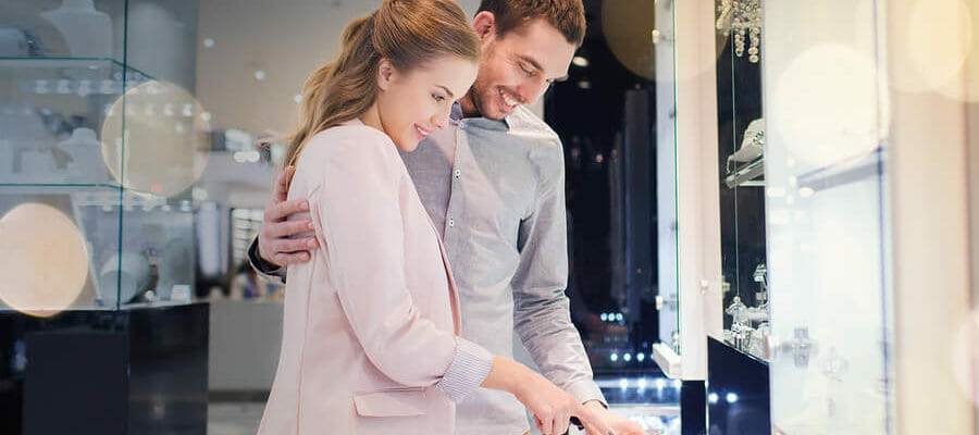 couple shopping for rings at a jewelry store